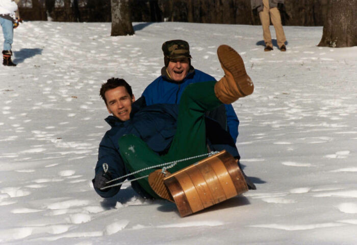 "George H. w. Bush Takes A Toboggan Ride With Arnold Schwarzenegger At Camp David. 1991"