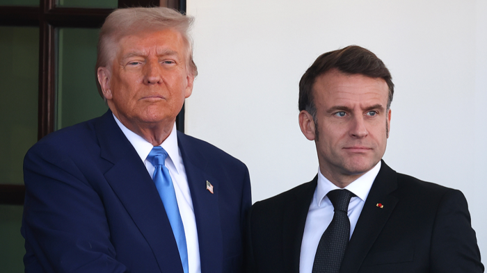 Trump holds up a message from Macron, warning of major tariffs