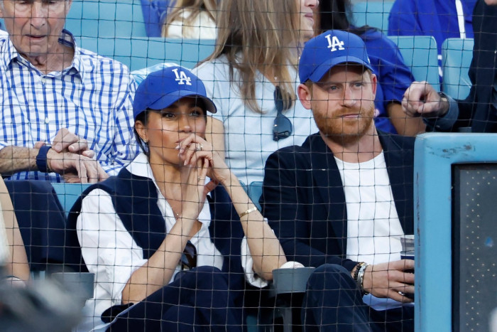 Kim Kardashian speaks on stage, referencing Harry and Meghan photo deletion
