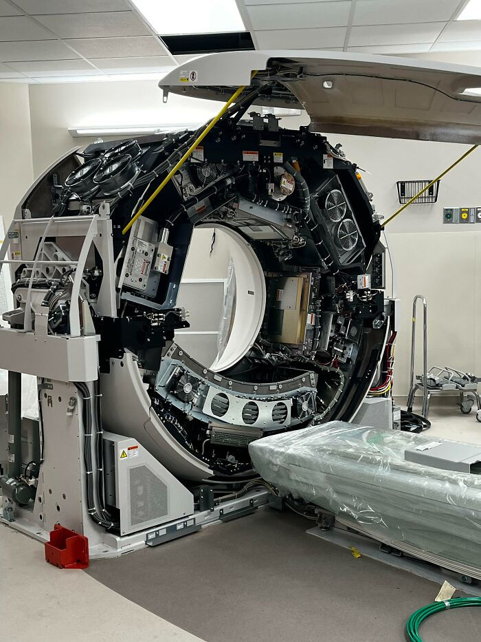 27. Inside a CT scanner, which is undergoing maintenance.