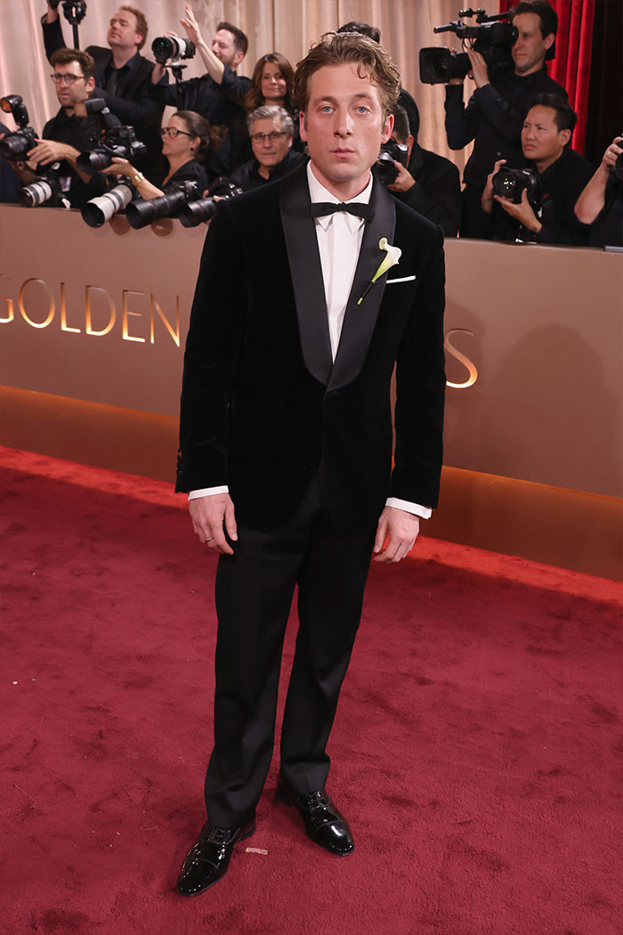 Jeremy Allen White - The Bear star wore a custom Louis Vuitton tuxedo with a velvet collar and calla lily pin, finished with a slim bow tie and polished Louboutin derbies.