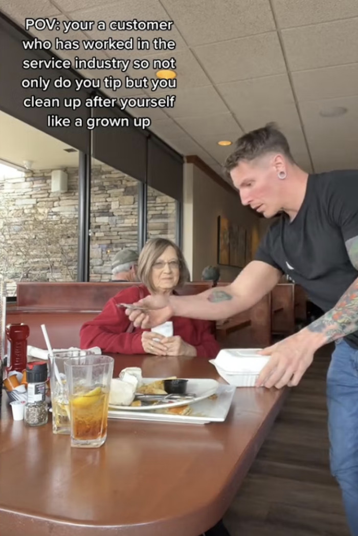 The TikToker not only cleaned the table but also left a tip for the server.