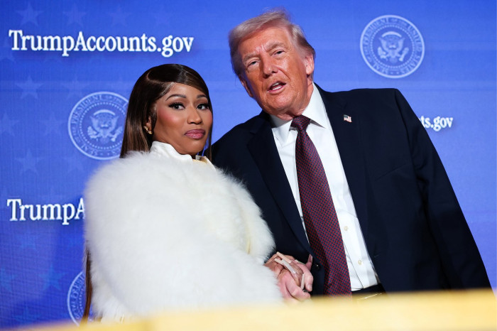 Nicki Minaj speaking at Turning Point USA event, addressing political controversy.