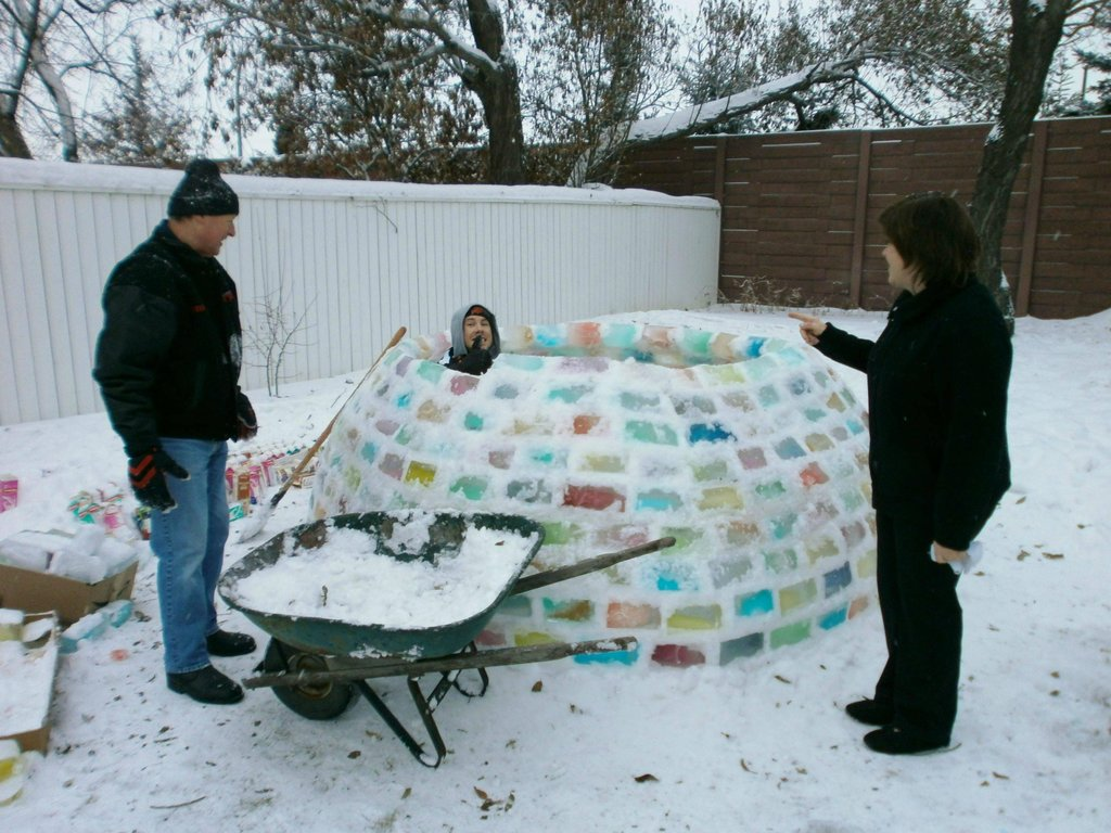 Finally, their labor bore fruit in the form of an astonishing igloo, a kaleidoscope of colors crafted from snow and repurposed milk carton blocks.