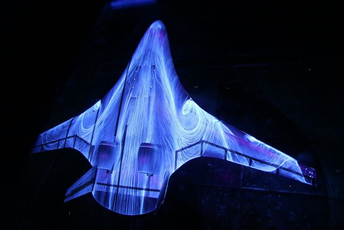 "A Futuristic Hybrid Wing Body During Tests In The Wind Tunnel At NASA's Langley Research Center. The Patterns Are Formed By Air Movement Over The Fluorescent Oil Sprayed Onto The Wings"