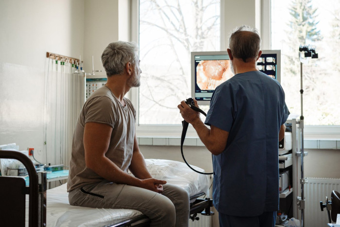 Doctor explains post-colonoscopy recovery tips, focusing on gradual food reintroduction.