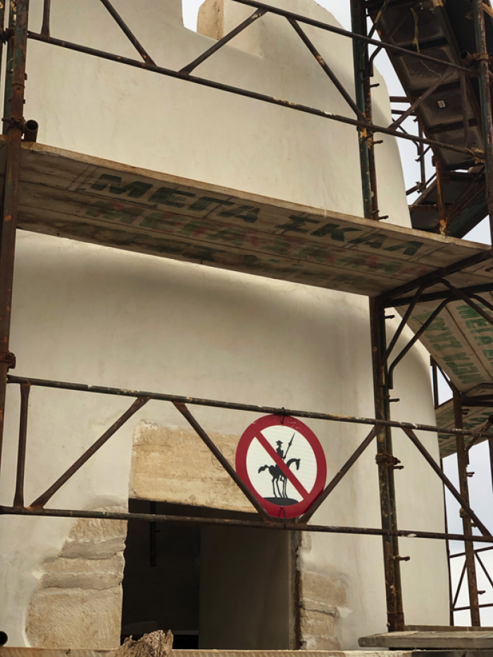 9. “A sign at a windmill restoration site in Mykonos, Greece.”
