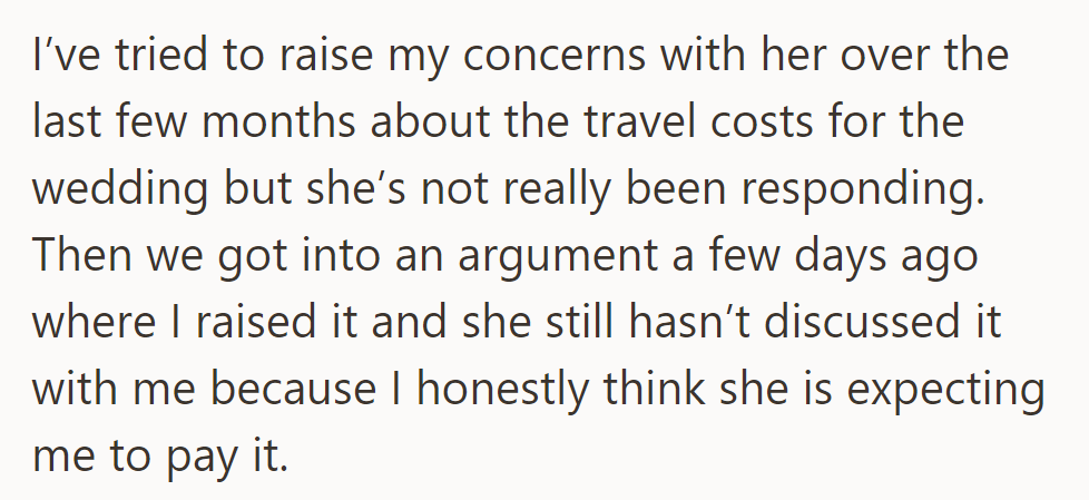 He's tried discussing wedding travel costs, but she hasn't responded. He feels she expects him to pay.