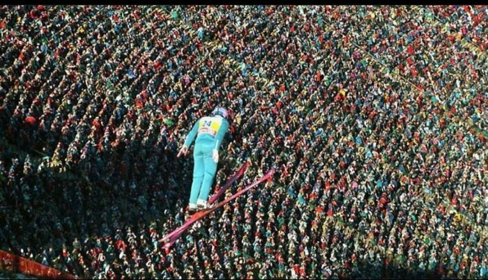 "Eddie "The Eagle" Edwards Soars Above A Roaring Crowd At The 1988 Winter Olympics. He Finished Last"