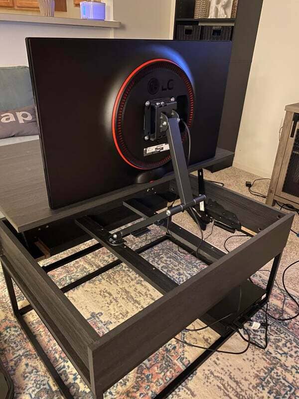 36. I customized my coffee table to have a pull-out gaming monitor.