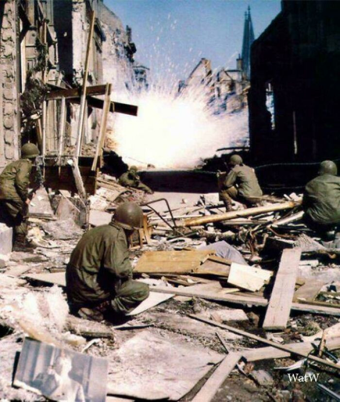 "U.S. Infantry Take Cover as a White Phosphorus Round Explodes in the Background—Cologne, March 1945."