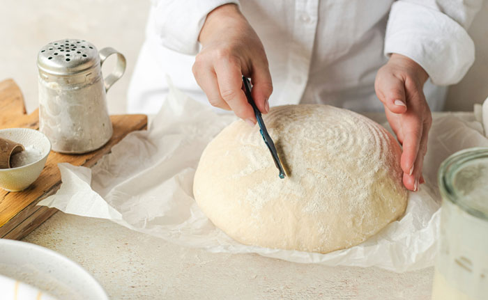 22. Small one, making bread.