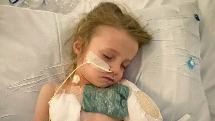 Family members in hospital setting, discussing amputation and radiotherapy for aggressive cancer