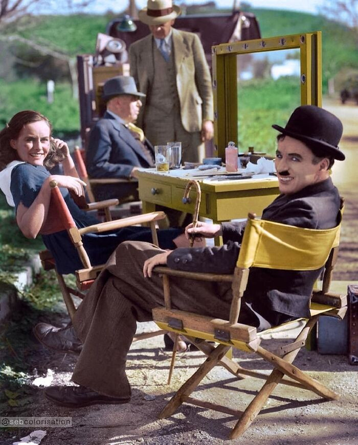 35. Paulette Goddard And Charlie Chaplin (Dressed As His Famous Character The Tramp) Photographed In 1936 Resting On The Set Of The Silent Film Modern Times