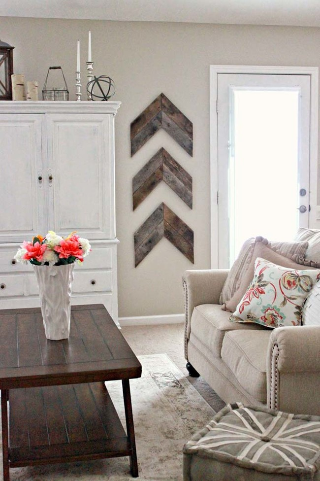 6. Slice reclaimed wood into arrow shapes and mount them on the wall to achieve a blend of tidy yet rustic home decor.