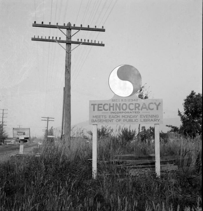 A roadside sign promoting Technocracy Inc. stands in Josephine County, Oregon, photographed in 1939.