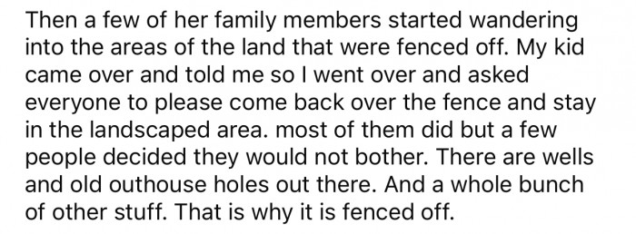 The fenced-off landscaped area has wells and old holes that could potentially be dangerous.
