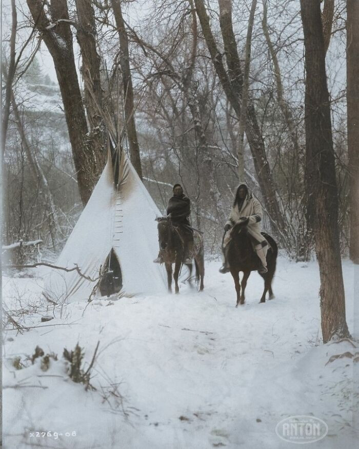 22. Wo Apsaroke Native Americans On Horseback Outside Of A Tipi In A Snow-Covered Forest In Montana In 1908