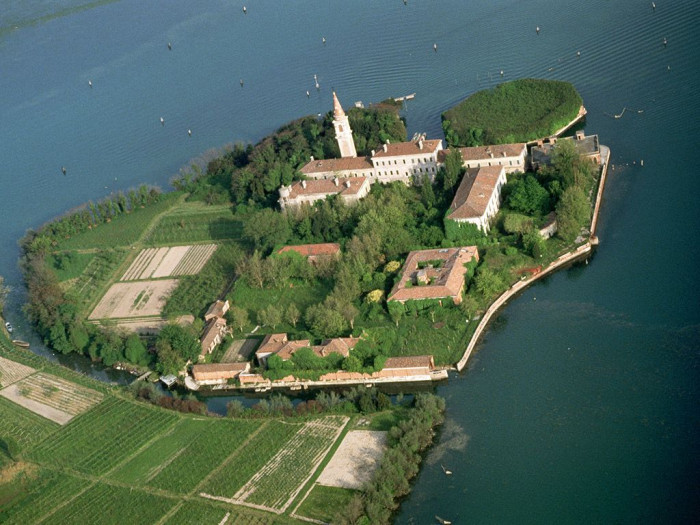 Historic Poveglia Island buildings, eerie asylum atmosphere during Venice plague quarantine years