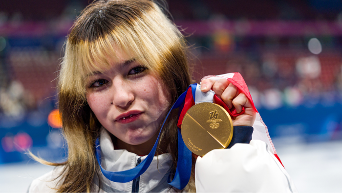 Close-up of Olympic medals showing wear, discussed during Milan games controversy investigation
