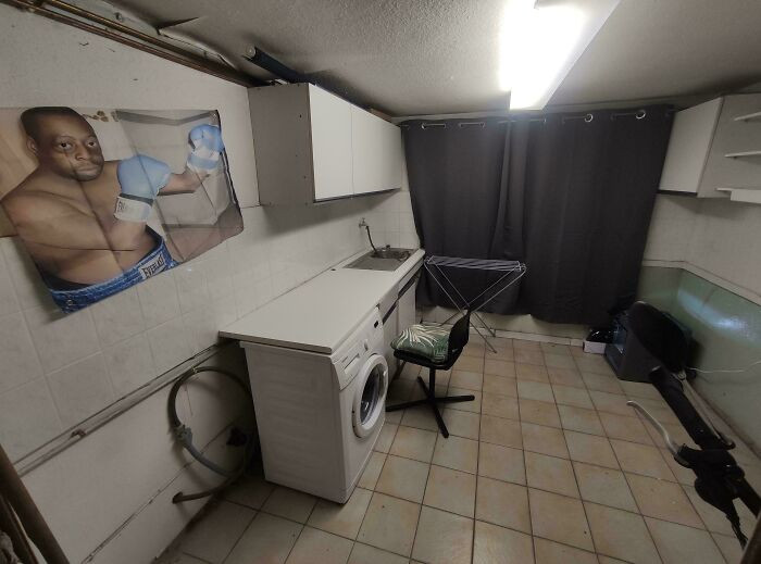 Mens bedroom retreat with secluded writing spot inside old boat sheds