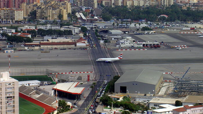 "The Runway At The Gibraltar International Airport Has A Road Crossing It"