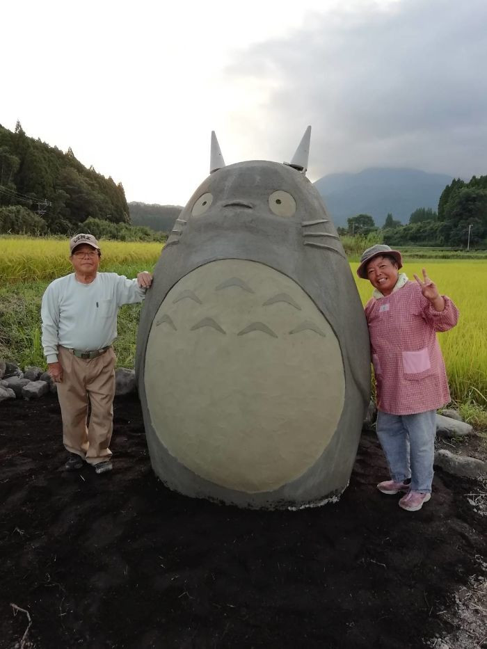 Standing tall and content with his creators is Totoro