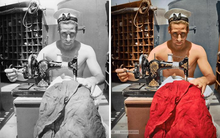 A British sailor on board the HMS ALCANTARA uses a portable sewing machine to repair a signal flag during a voyage to Sierra Leone. Photographed by Cecil Beaton in March 1942.