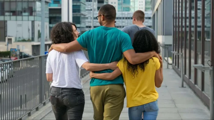 People in a circle sharing feelings, navigating tolyamorous relationship dynamics