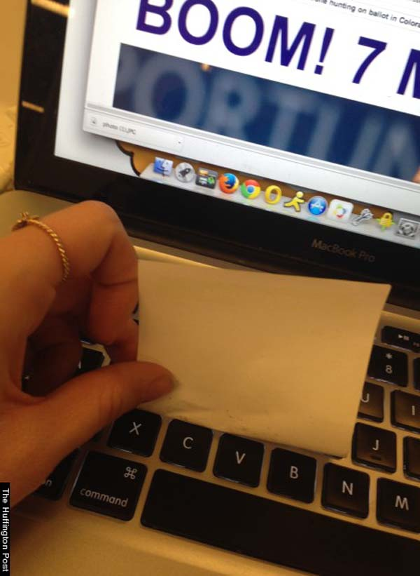 A sticky note can help you clean your keyboard.