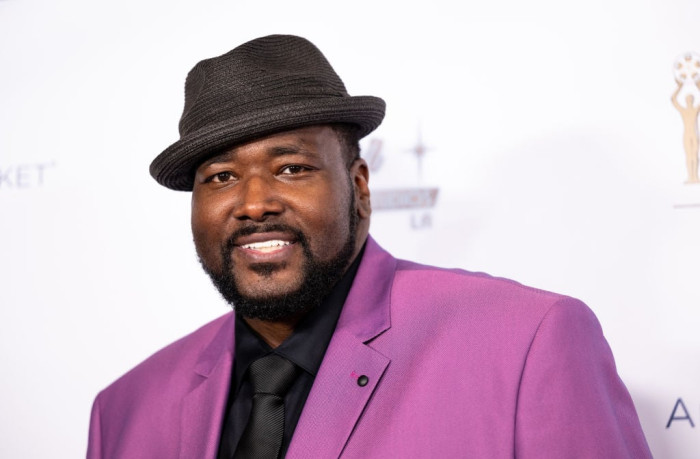 Quinton Aaron outside a studio setting, discussing fall prevention and safety.