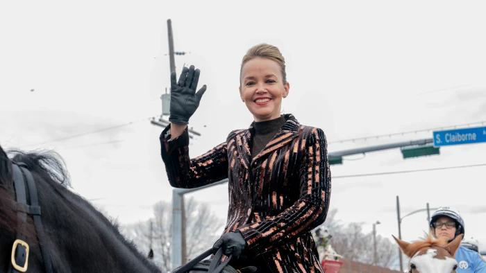 Parents and community members react at a Mardi Gras parade controversy event.