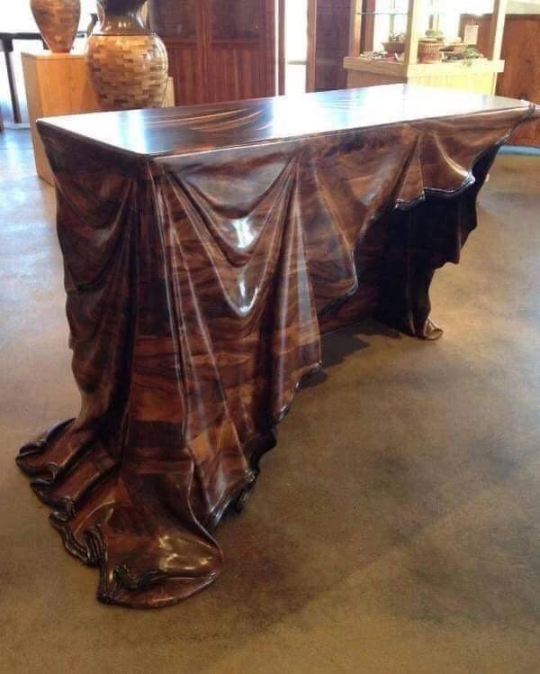 17. “This table carved from a single block of wood”