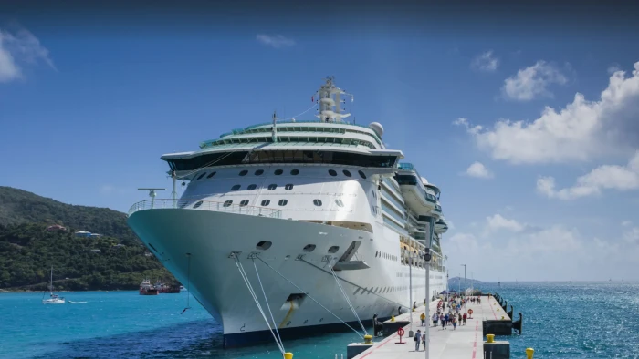 Norwegian Cruise Line ship at sea, referencing backlash over strict dress code policy