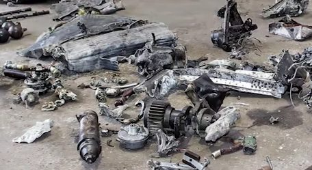 In addition to fragments of the aircraft and skeletal remains, those conducting the excavation unearthed ration stamps for the canteen, the pilot's wallet, three unused condoms, his hat, and coins from Denmark.