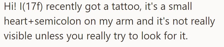 OP recently got a small heart and semicolon tattoo on her arm. It's not very visible unless you look closely.