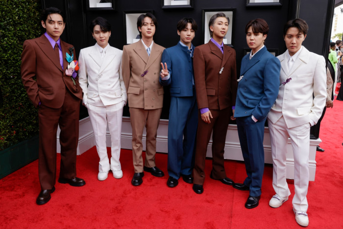 BTS performing at Stanford Stadium, fans anticipate a May 2026 concert frenzy