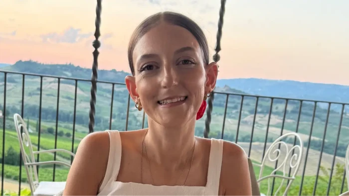 Tamara speaking at a cancer awareness event, advocating for young women’s health.