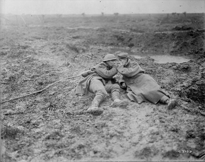 "A Wounded Canadian And A Wounded German In The Mud Of Passchendaele Sharing A Smoke. November, 1917"