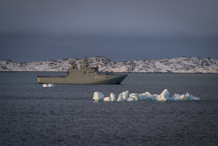 Greenland icebergs and coastline, highlighting strategic resource acquisition and military tensions