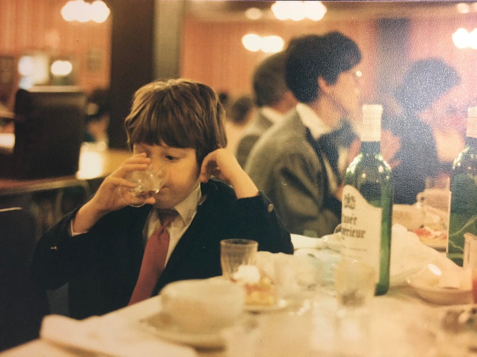 6. “Stealing a drink of wine at a wedding while my mom (behind me) isn’t looking. (1987)”