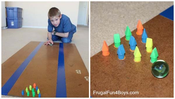 20. Make a mini bowling game with pencil erasers and marbles