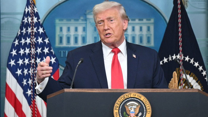 Donald Trump speaking at a rally, referencing Renee Good and immigration support