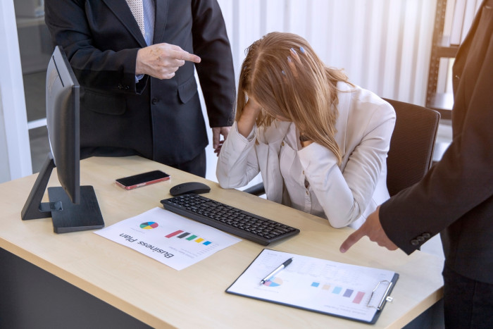 Workplace coaching discussion about managing a narcissistic boss, constructive feedback, and relationship strategies