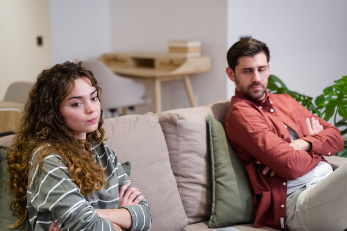 Person researching trust issues, reflecting on betrayal in a romantic relationship