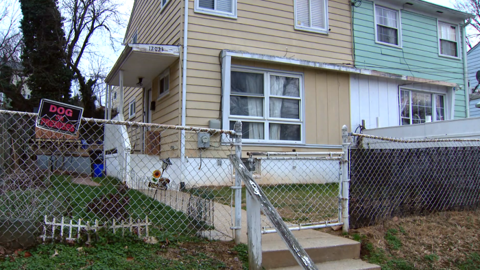 Community members and investigators gather outside during Wynter Wagoner missing case investigation