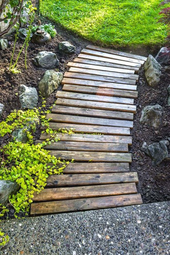 5. Wooden planks transform into a charming garden pathway without the need for sanding.