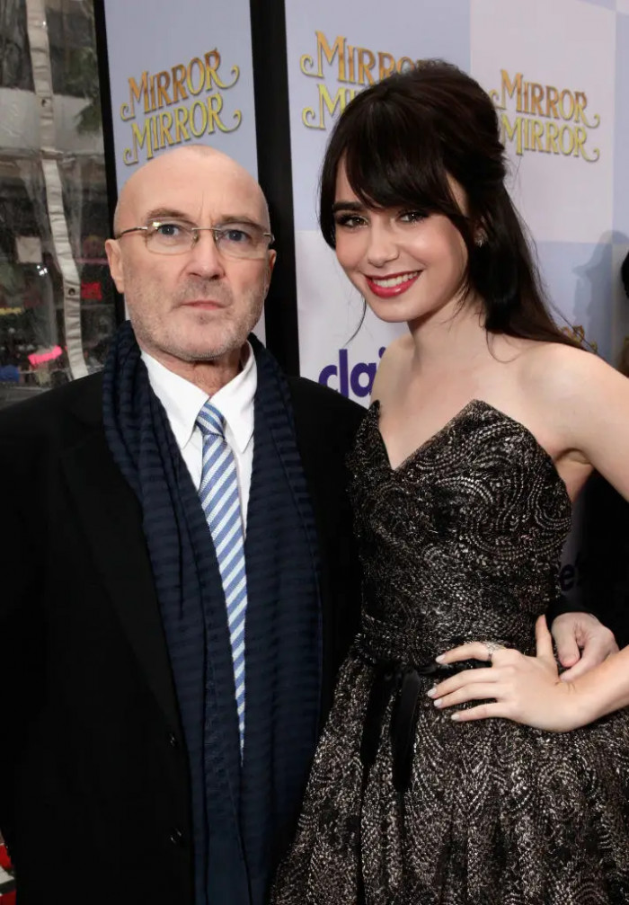 9. Lily Collins is the daughter of famous singer-songwriter Phil Collins.