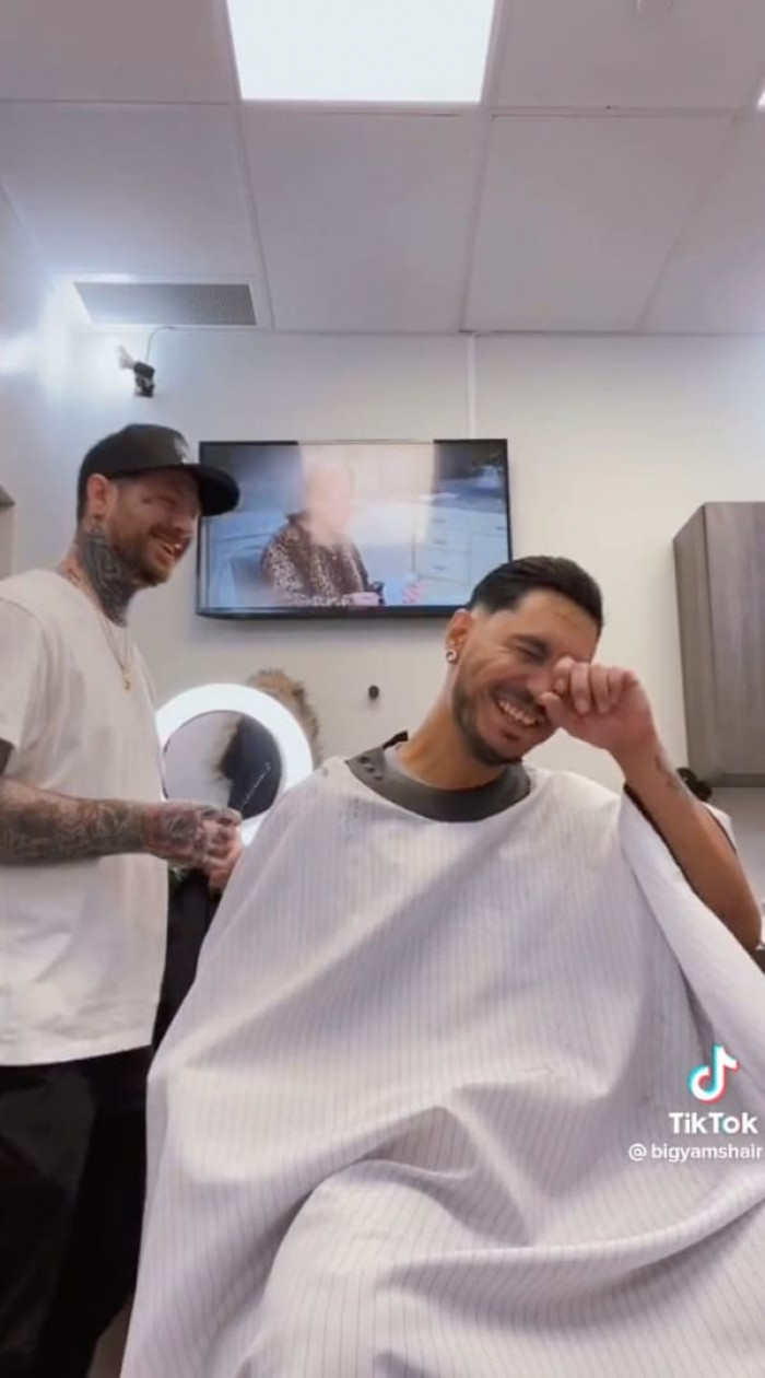 But this barber has taken things up a notch, and it's all smiles from everyone.