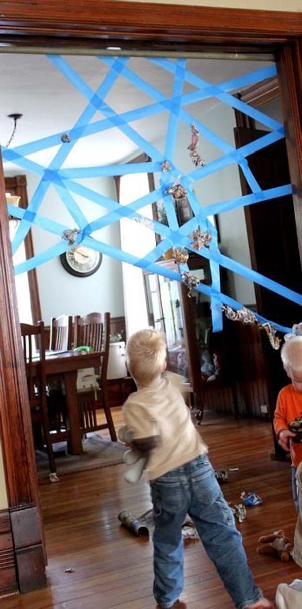 25. Strands of painter’s tape can form a fun, sticky spiderweb